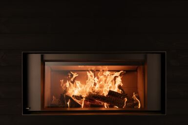 Open fireplace vs wood insert: which heats better and why?